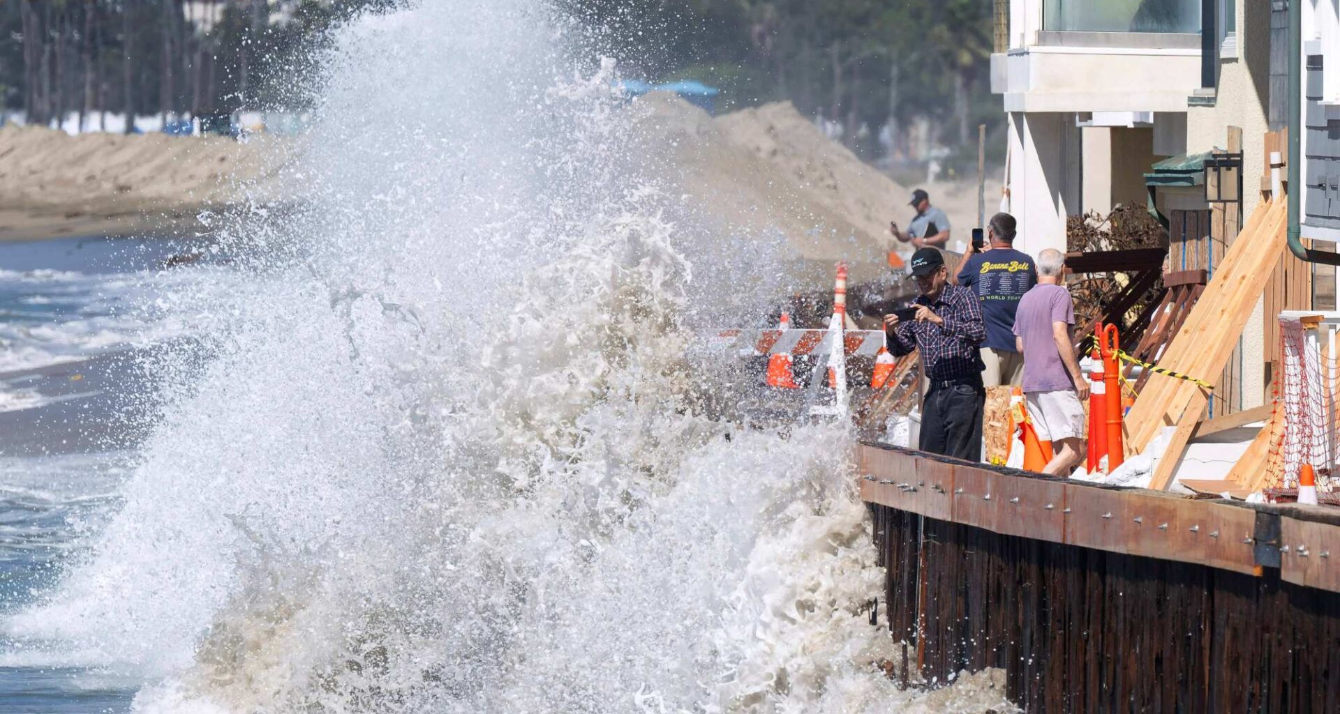 High tide, waves crash against Long Beach boardwalk from Hurricanes Odalys, Polo – Orange County Register