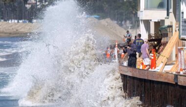 High tide, waves crash against Long Beach boardwalk from Hurricanes Odalys, Polo – Orange County Register