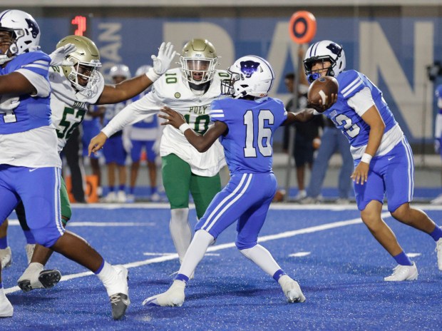 Jordan quarterback Caydyn Hampton (16) tries to pass to an open teammate as the Panthers take on Long Beach Poly in Long Beach, CA, on Friday, Sept. 19, 2025. (Photo by Tracey Roman, Contributing Photographer)