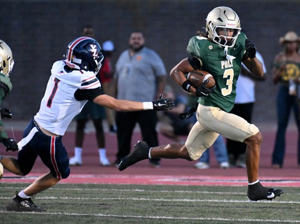 Long Beach Poly senior Jayden Coley (3) carries against Yorba Linda in a non-league game at Veterans Stadium in Long Beach on Friday August 28, 2026. (Photo by Axel Koester, Contributing Photographer)