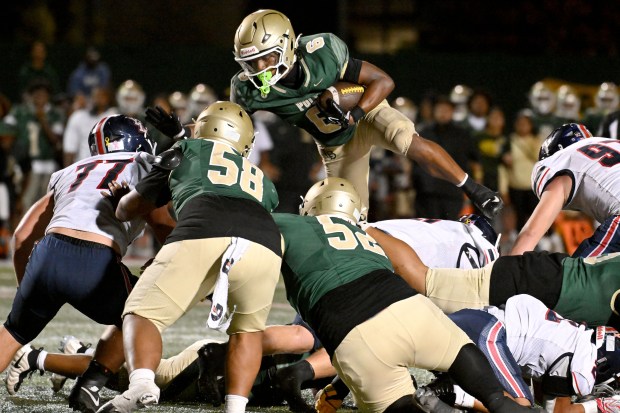 Long Beach Poly sophomore running back Elijah Dawson (6) carries against Yorba Linda in a non-league game at Veterans Stadium in Long Beach on Friday August 28, 2026. (Photo by Axel Koester, Contributing Photographer)