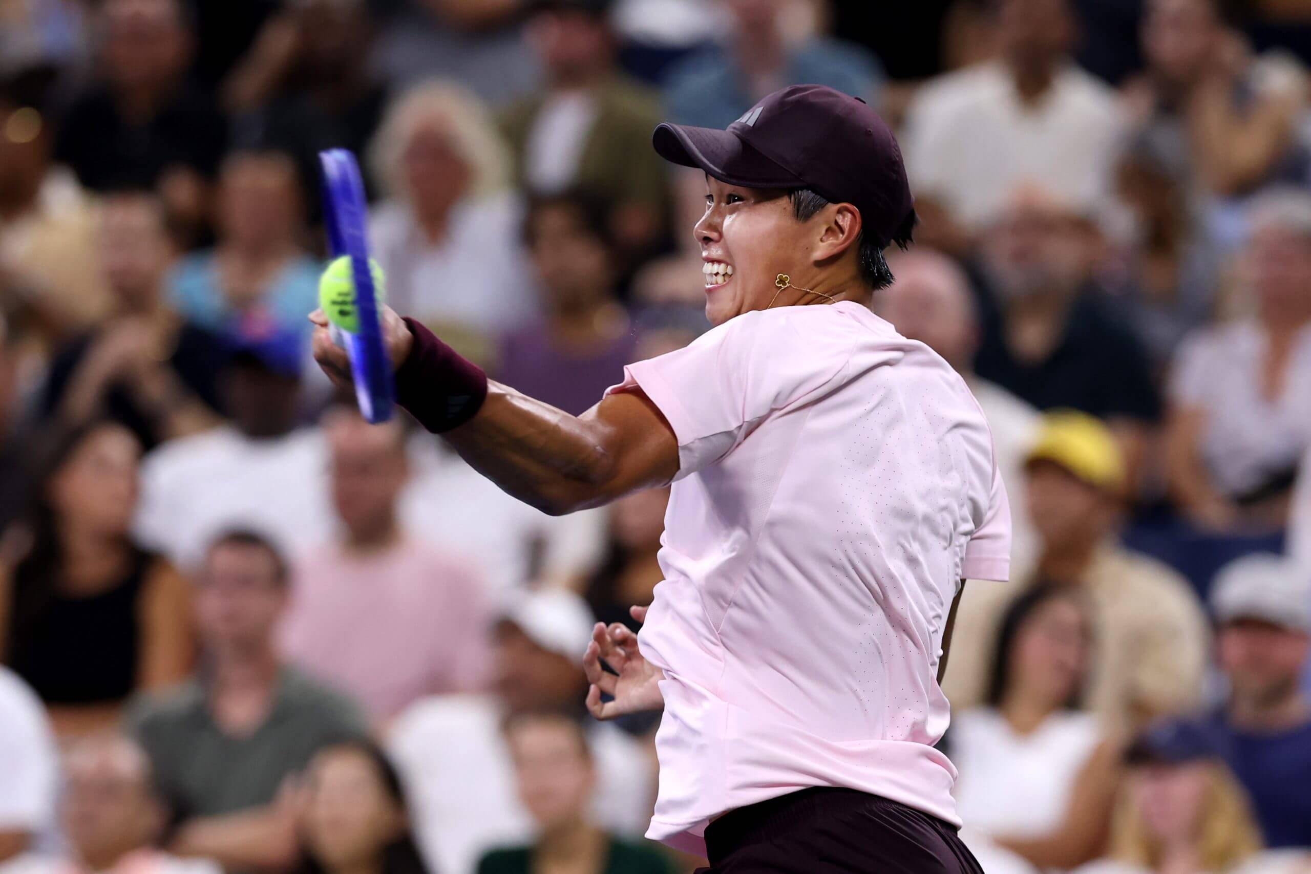 Learner Tien hits a forehand.