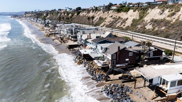Heavy equipment moves boulders into place to protect homes along Beach Road in Dana Point on Thursday, September 10, 2026. Several homes were red- or yellow-tagged after high tides and heavy surf hit the strip of homes between Coast Highway and the ocean. (Photo by Paul Bersebach, Orange County Register/SCNG)