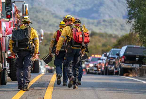Orange County Fire Authority firefighters carry various tools as they prepare to head south of Ortega Highway on foot while battling the Gibby Fire in Trabuco Canyon on Wednesday, September 2, 2026. (Photo by Jeff Antenore, Orange County Register/SCNG)