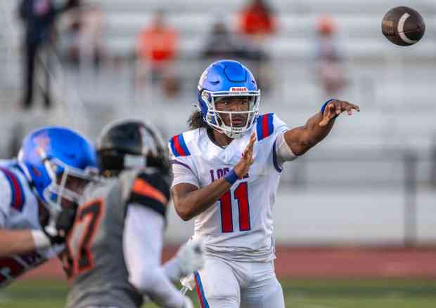 Los Alamitos quarterback Elijah McDaniel (11) throws the ball during a nonleague game against Huntington Beach in Huntington Beach on Thursday, August 27, 2026. (Photo by Jeff Antenore, Orange County Register/SCNG)