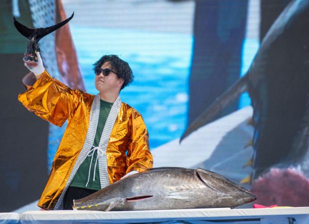 Hiroto, from Osaka, Japan, demonstrates how to cut a 135-pound tuna, worth about $5,000, during the Tuna Cutting Show on the OC Stage during the annual OC Japan Fair in Costa Mesa on Saturday, April 5, 2025. (Photo by Jeff Antenore, Contributing Photographer)