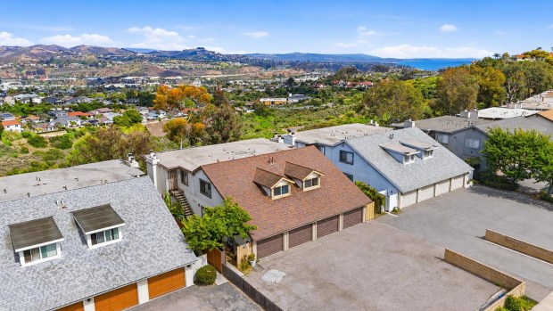 This four-unit apartment building, center, in Dana Point sold Aug. 21, 2026, for $2.2 million. The complex at 33372 Cheltam Way was built in 1977 and features two-bedroom units. (Photo courtesy of Morgan Skenderian Investment Real Estate Group)