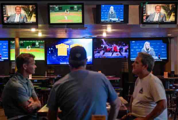 Patrons watch sports on multiple screens at Classic Q Billiards and Sports Club in Newport Beach on Wednesday, August 26, 2026. (Photo by Jeff Antenore, Orange County Register/SCNG)