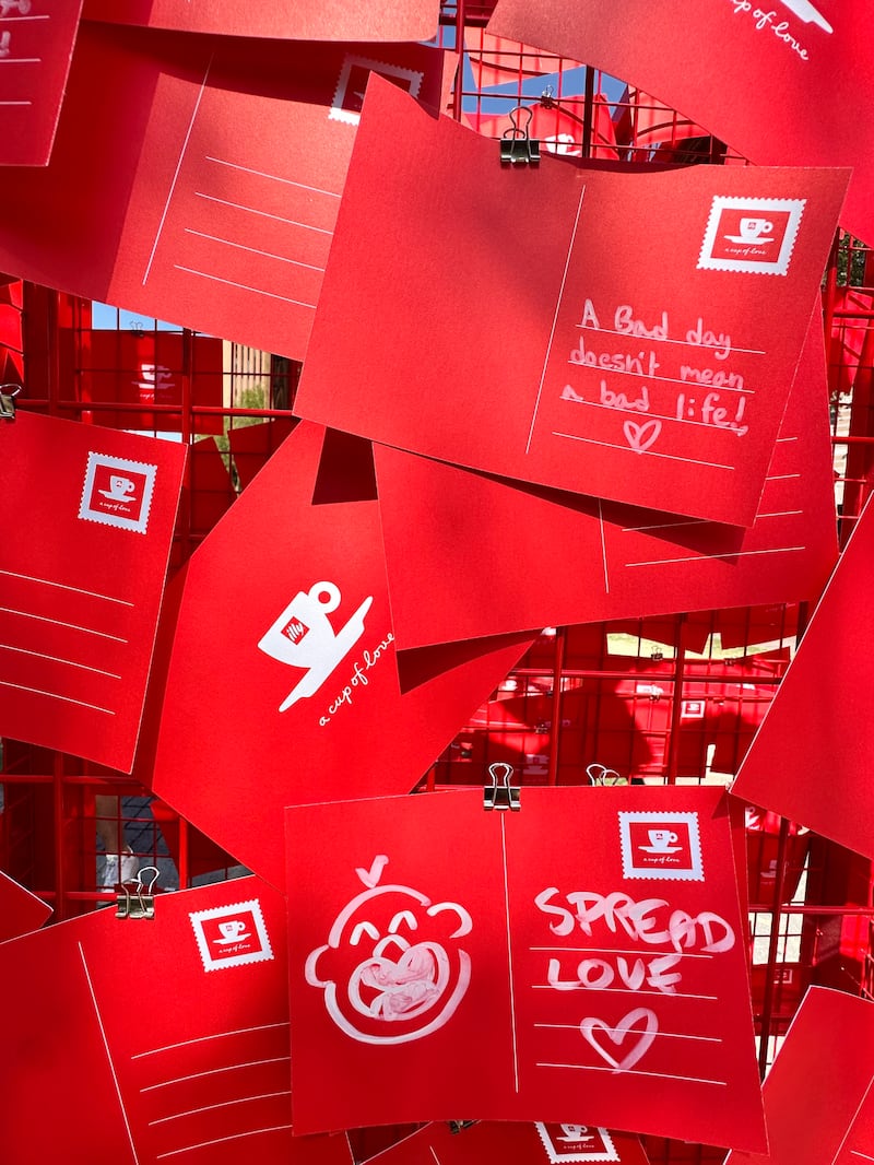 Red postcards with motivational messages written on them.