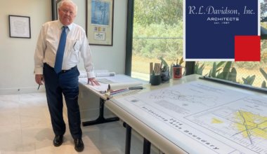 R.L. Davidson founder Robert Davidson stands beside architectural plans in the firm’s Clovis office.