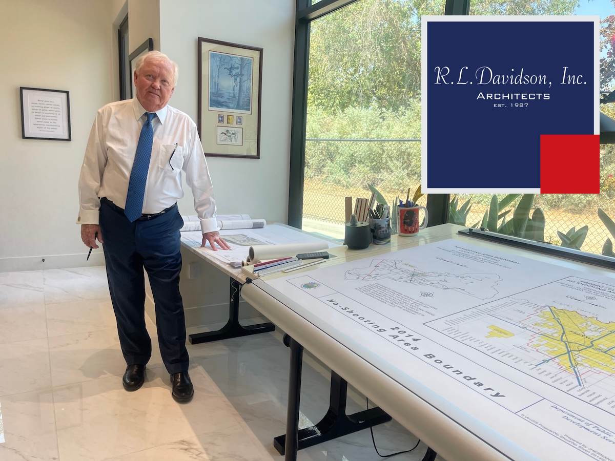 R.L. Davidson founder Robert Davidson stands beside architectural plans in the firm’s Clovis office.