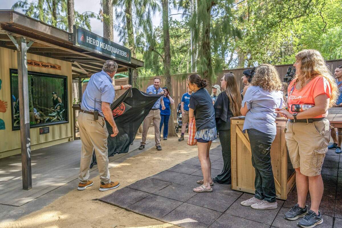 Sacramento Zoo CEO Dan Simon, left, and chief animal program officer Matt McKim, right, unveil the new interactive habitat for the zoo's African giant pouched rats last month.
