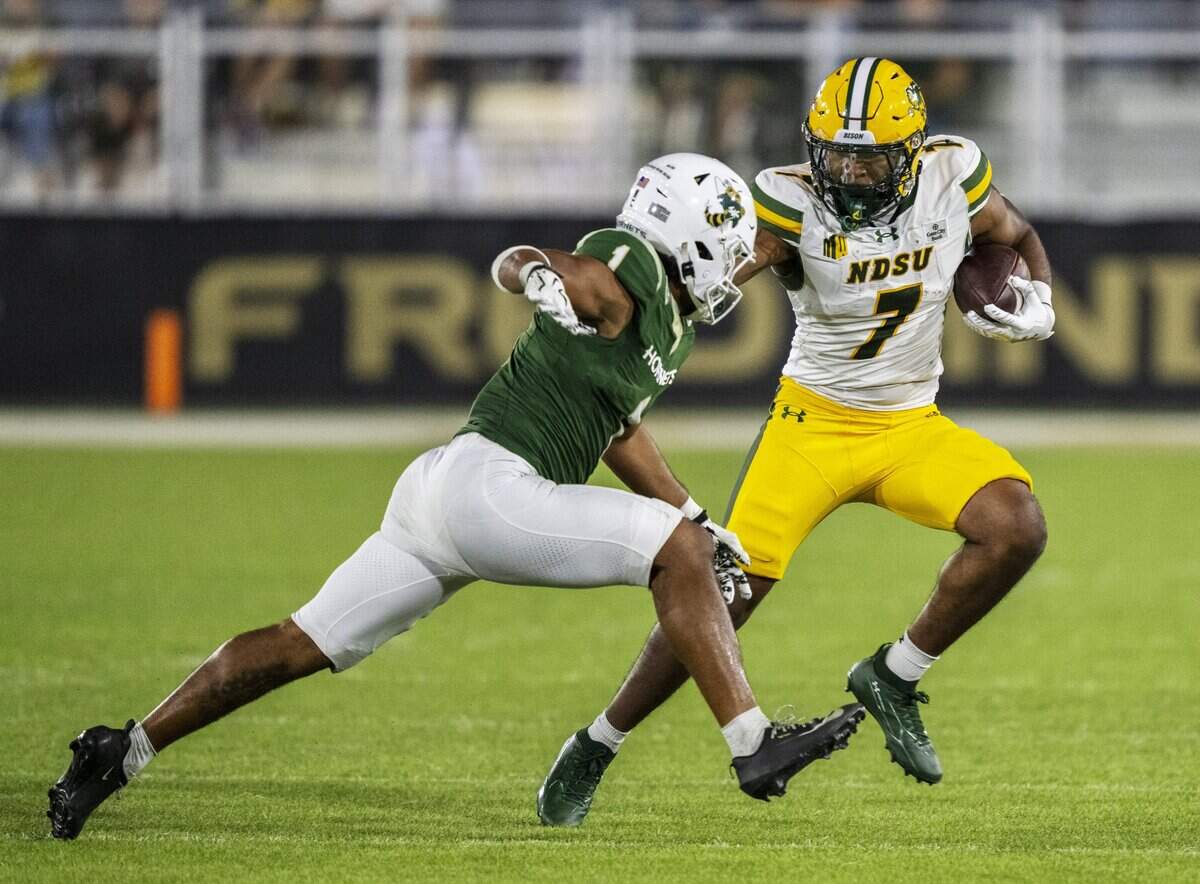 Sacramento State Hornets safety Boogsie Silvera (1) brings down North Dakota State Bison running back Chance Tucker (7) in the first half Saturday in Sacramento.