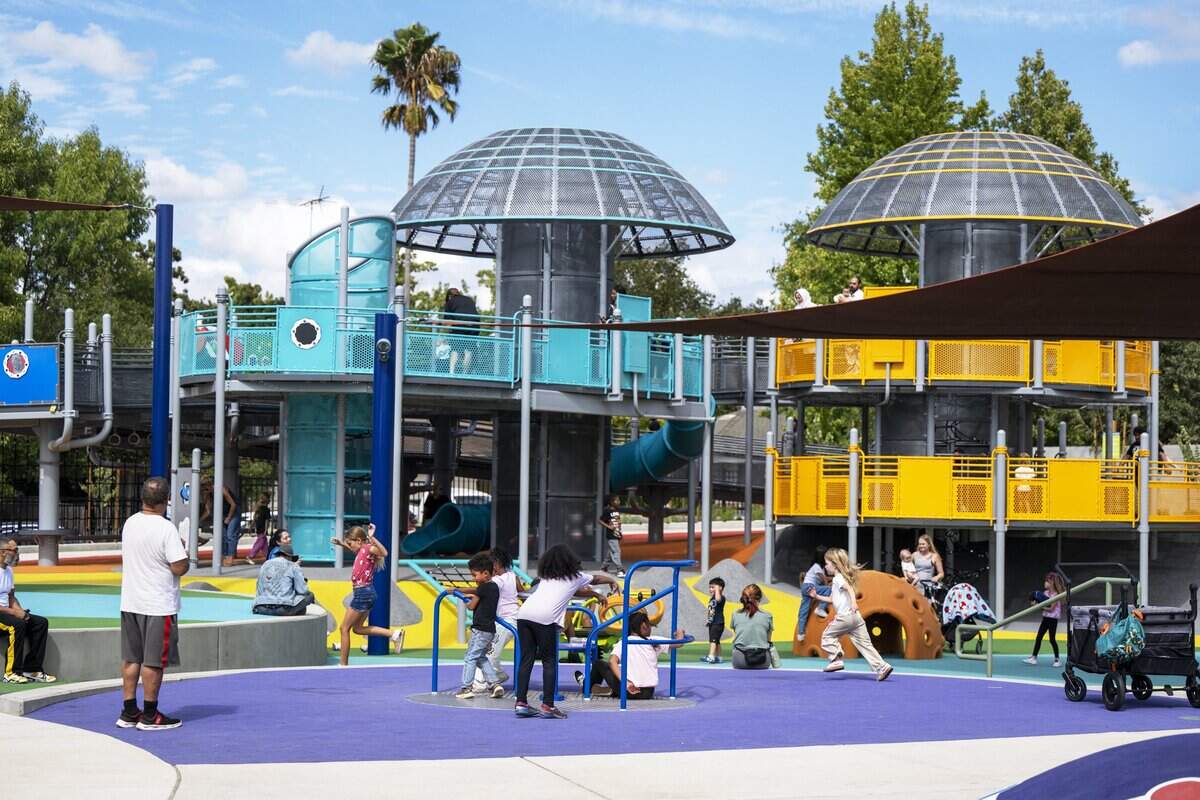 Children play at the new Empowerment Park, a sensory-friendly playground on Bell Street in Arden Arcade, on Wednesday.