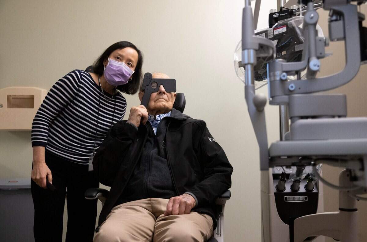 Dr. Michele Lim gives Ernest Tschannen the first eye exam at the new Ernest E. Tschannen Eye Institute in Sacramento in 2022.