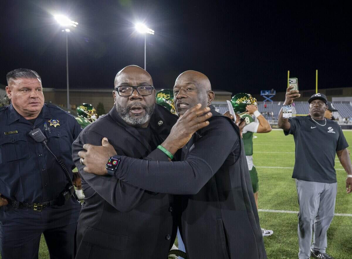 Sacramento State Hornets head coach Alonzo Carter, left, embraces Mississippi Valley State head coach Terrell Buckley following the Hornets 52-0 victory on Saturday, Sept. 5, 2026 in Sacramento.
