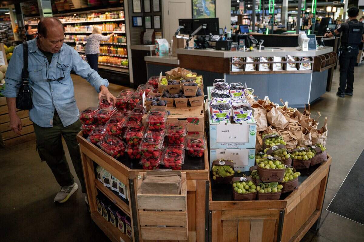 A customer shops for strawberries at Sacramento Natural Foods Co-op on Tuesday, Sept. 1, 2026.