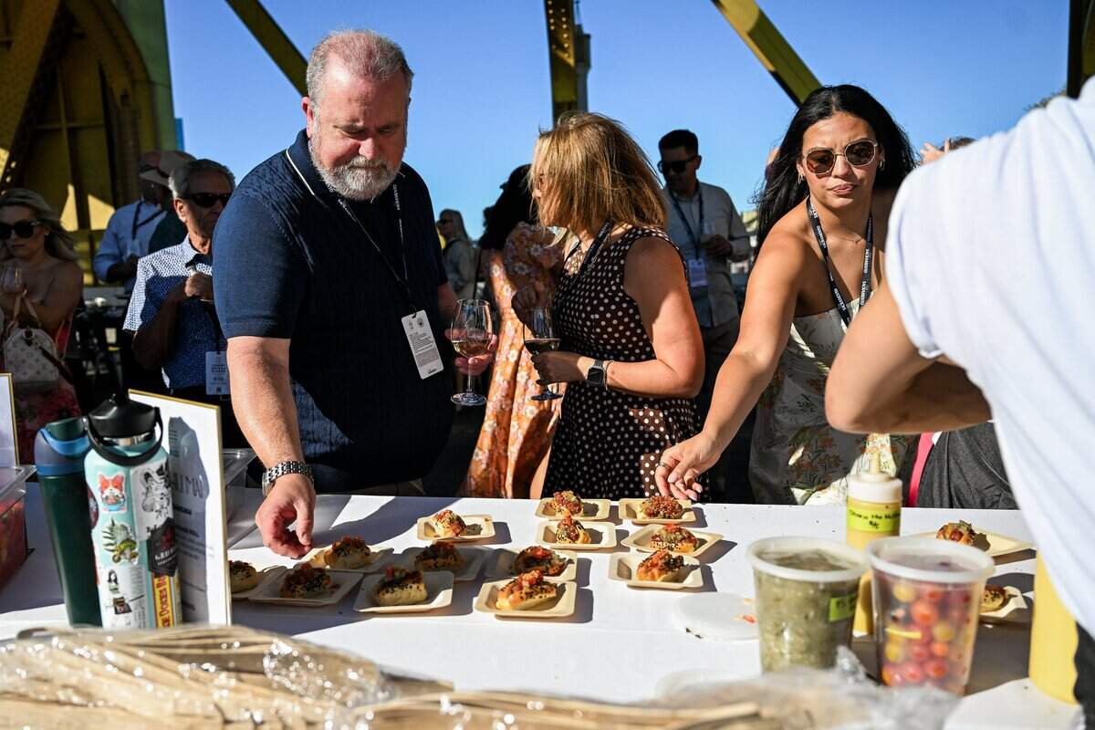 Guests sample appetizers during the Tower Bridge Dinner in Sacramento on Sunday.