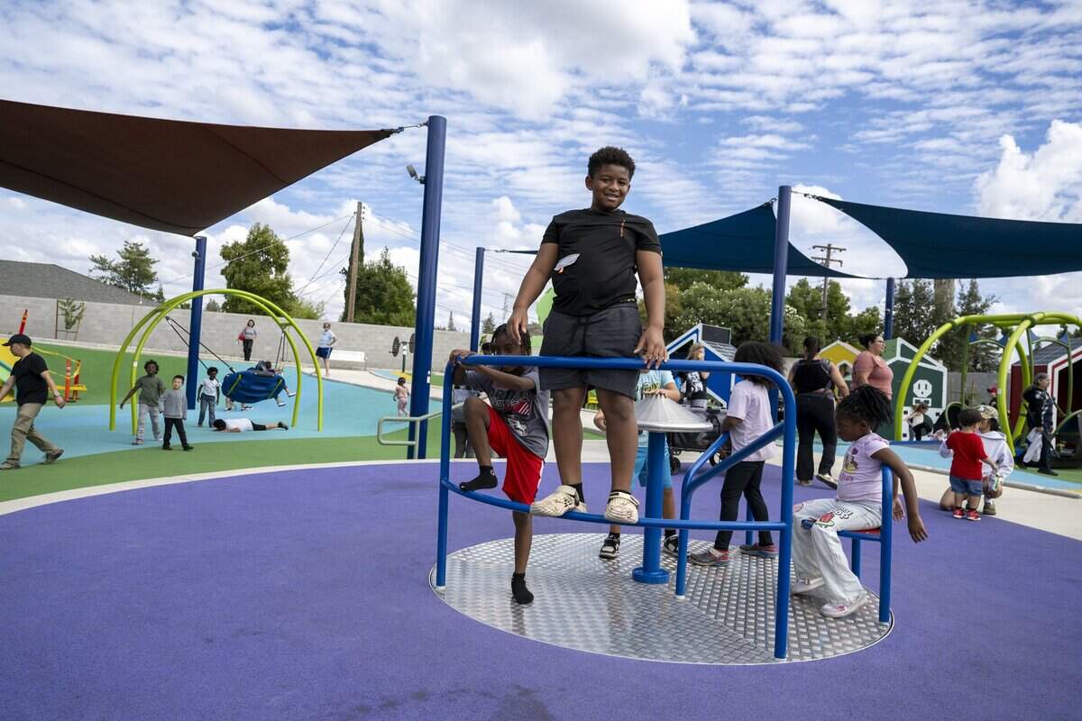 Children play at the new Empowerment Park, a sensory-friendly playground on Bell Street in Arden Arcade, on Wednesday.