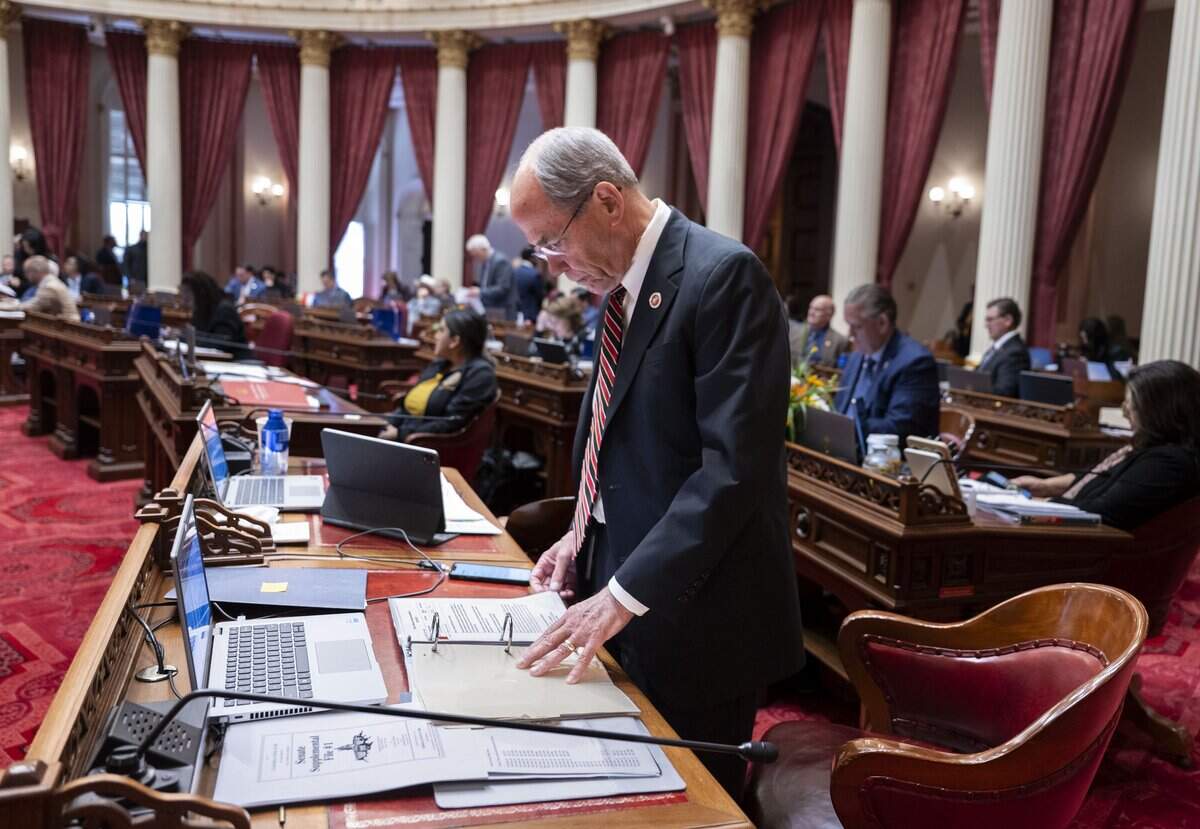 State Sen. Roger Niello, R-Fair Oaks, looks through a binder during the last day of the legislative session on Monday, Aug. 31, 2026. Niello will become the Republican leader at the start of the next session.