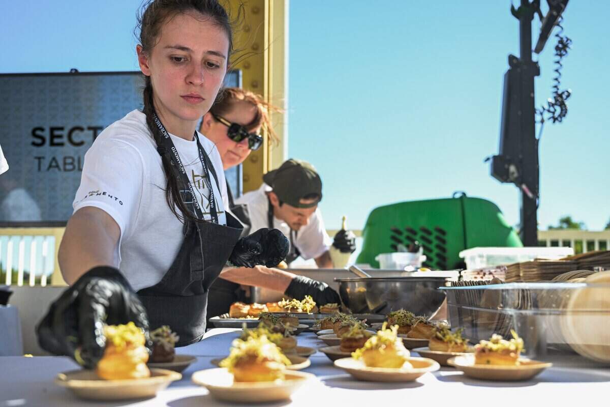 Kitchen staffers prepare appetizers during the Tower Bridge Dinner in Sacramento on Sunday, Sept. 6, 2026.