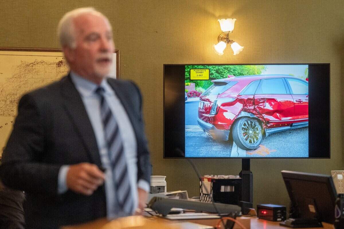 Attorney Roger Dreyer shows a picture of Phil Oates’ red Cadillac during Oates’ trial in a wrongful death case at Placer Superior Court in Auburn on Tuesday.