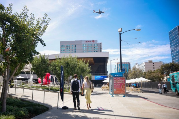 People walk towards the San Jose McEnery Convention Center in downtown San Jose, Calif., on Thursday, Sept. 24, 2026. (Shae Hammond/Bay Area News Group)
