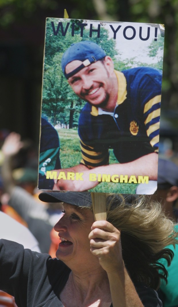 During the 32nd annual Gay Pride Parade in San Francisco, Alice Hoglan carries a photo of her son, Mark Bingham, a member of the gay-inclusive San Francisco Fog Rugby Football Club, who, along with his flight mates, is believed to have stormed the cockpit to try to wrest it from terrorists before it crashed into the Pennsylvania countryside. (Jim Gensheimer/Bay Area News Group archive)