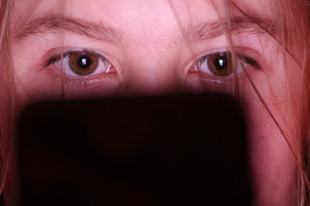 Assembly Bill 1709 would ban social media companies from providing "addictive" features to kids under 16. Companies would have to verify ages before serving addictive content. (Photo illustration by Jan Woitas/picture-alliance/dpa/AP Images)