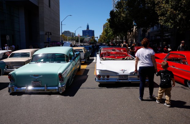People look at cars on display at the fourth annual San Jose Lowrider Day along East Santa Clara Street in front of San José City Hall in downtown San José, Calif., on Sunday, Sept. 6, 2026. (Nhat V. Meyer/Bay Area News Group)