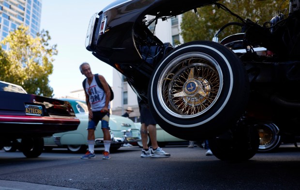 People look at cars on display at the fourth annual San Jose Lowrider Day along East Santa Clara Street in front of San José City Hall in downtown San José, Calif., on Sunday, Sept. 6, 2026. (Nhat V. Meyer/Bay Area News Group)