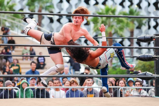 Luchadores Andrew Cass, left, and Danny Orion perform during Lucha Libre Wrestling Night at Thrive City Plaza in San Francisco, Calif., Thursday, Sept. 24, 2026. Twenty-two wrestlers performed in six matches during the free event hosted by West Coast Pro Wrestling and Pro Wrestling Revolution. (Ray Chavez/Bay Area News Group)