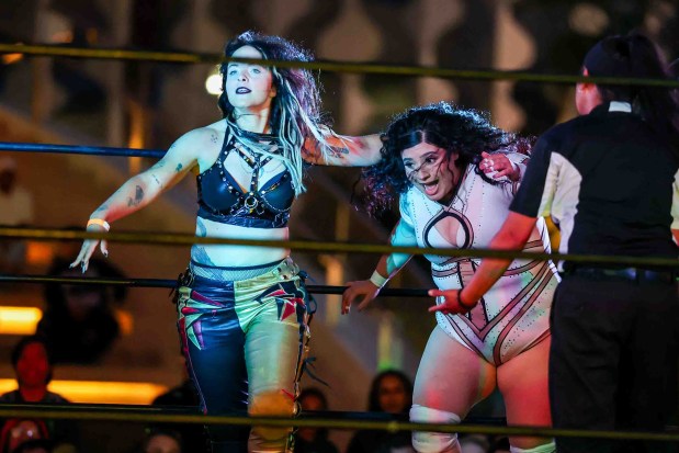 Luchadoras Carma, left, and Miko Alana perform during Lucha Libre Wrestling Night at Thrive City Plaza in San Francisco, Calif., Thursday, Sept. 24, 2026. Twenty-two wrestlers performed in six matches during the free event hosted by West Coast Pro Wrestling and Pro Wrestling Revolution. (Ray Chavez/Bay Area News Group)