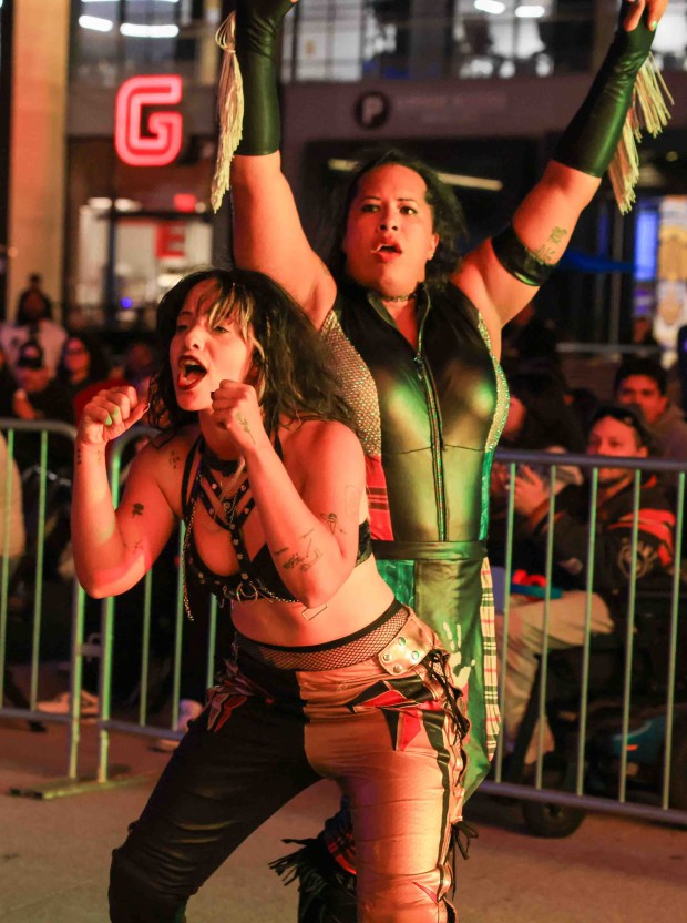 Luchadoras Carma, left, and Nyla Rose celebrate their victory over Johnnie Robbie and Miko Alana during Lucha Libre Wrestling Night at Thrive City Plaza in San Francisco, Calif., Thursday, Sept. 24, 2026. Twenty-two wrestlers performed in six matches during the free event hosted by West Coast Pro Wrestling and Pro Wrestling Revolution. (Ray Chavez/Bay Area News Group)
