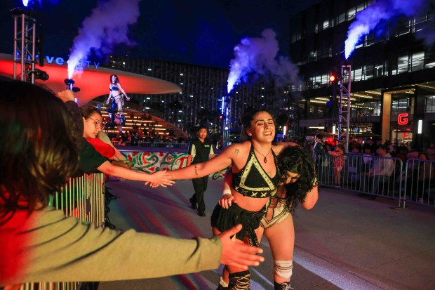 Luchadoras Johnnie Robbie, left, and Miko Alana head back to the locker room after competing against Carma and Nyla Rose during Lucha Libre Wrestling Night at Thrive City Plaza in San Francisco, Calif., Thursday, Sept. 24, 2026. Twenty-two wrestlers performed in six matches during the free event hosted by West Coast Pro Wrestling and Pro Wrestling Revolution. (Ray Chavez/Bay Area News Group)