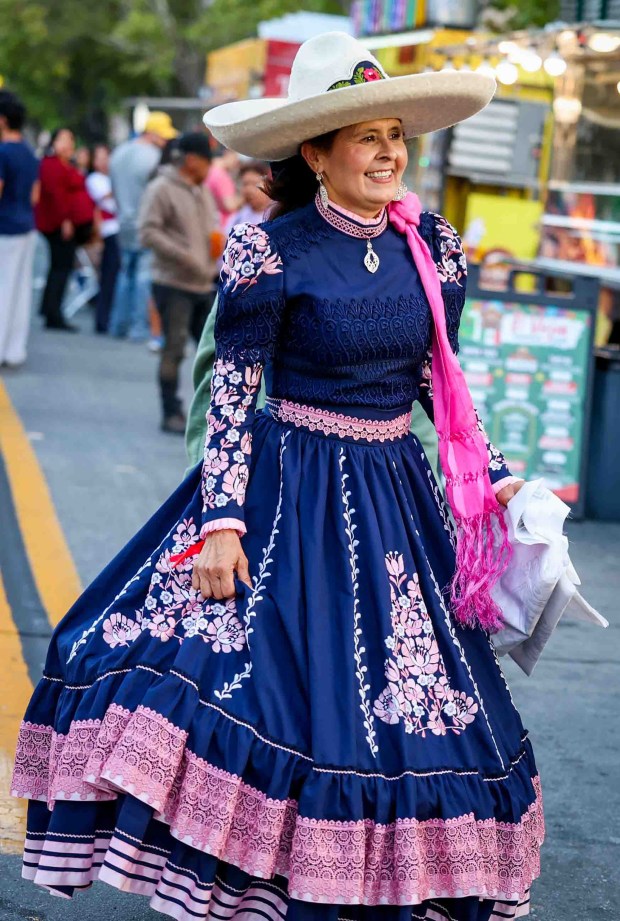 Patricia Rivera Esparza of San Jose, wears traditional Mexican ranchera clothing to honor the heritage passed down by her parentsa cultural tradition she now passes on to her children and grandchildren, she said, during the 216th anniversary of Mexican Independence Day celebrations at San Jose City Hall in San Jose, Calif., on Tuesday, Sept. 15, 2026. Hundreds of people gathered for "El Grito," or "The Cry," which was announced by Neftali Said Pérez González, consul general of Mexico in San Jose, alongside San Jose Mayor Matt Mahan. (Ray Chavez/Bay Area News Group)