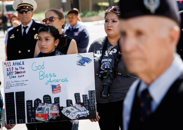 Genesis Samarron, 11, of San Jose, left, and her mother, Ruth Salas, right, attend the Patriot Day ceremony on the 25th anniversary of the Sept. 11 attacks in downtown San Jose on Friday, Sept. 11, 2026. (Dai Sugano/Bay Area News Group)