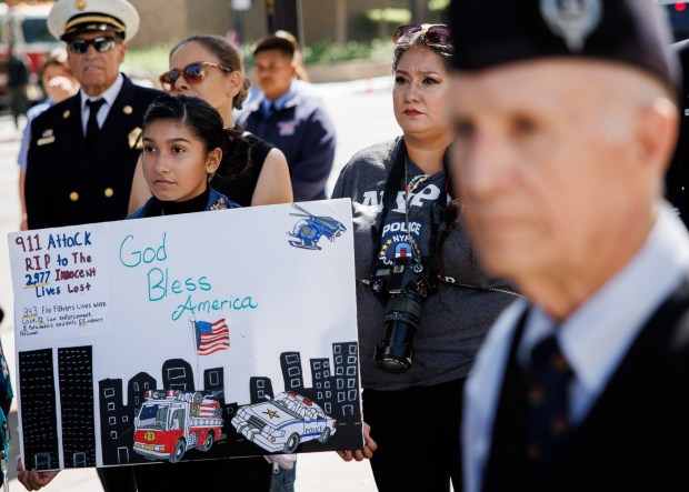 Genesis Samarron, 11, of San Jose, left, and her mother, Ruth Salas, right, attend the Patriot Day ceremony on the 25th anniversary of the Sept. 11 attacks in downtown San Jose on Friday, Sept. 11, 2026. (Dai Sugano/Bay Area News Group)
