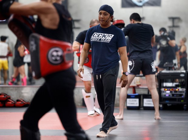 Head Coach Ed Carpio observes students during the Muay Thai Pad Work class at Condition and Competition Kickboxing, also known as Team CCK, in San Jose, Calif., on Tuesday, Sept. 1, 2026. (Nhat V. Meyer/Bay Area News Group)