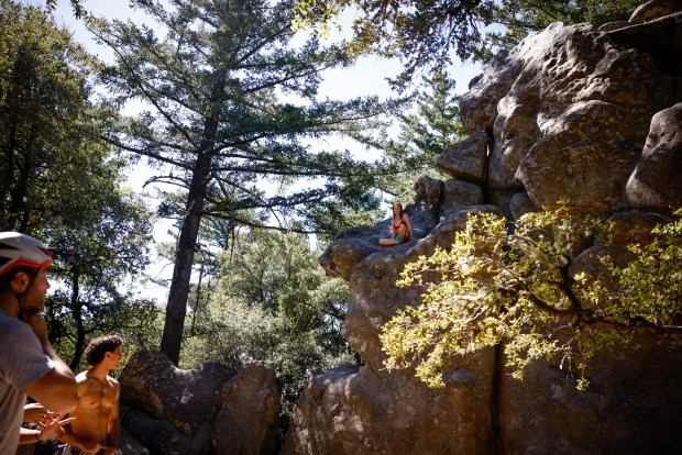 Sydney Forrester, of Santa Clara, sits on a rock she climbed at Castle Rock State Park in Los Gatos, Calif., on Friday, Sept. 11, 2026. (Shae Hammond/Bay Area News Group)