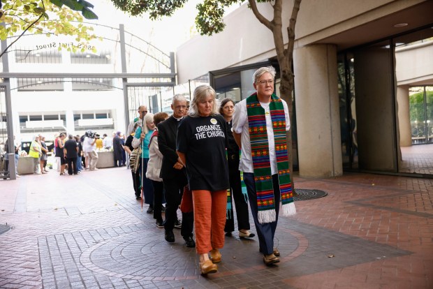 Religious representatives walk into the Federal Courthouse before a hearing about the ICE center being built in Gilroy at the Federal Courthouse in San Jose, Calif., on Tuesday, Sept. 8, 2026. (Shae Hammond/Bay Area News Group)
