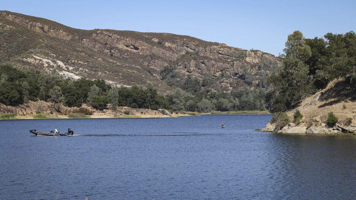A motorboat putters across Santa Margarita Lake on Sept. 2, 2026. A new law allows body contact with the water starting in January, but the details have yet to be worked out with San Luis Obispo County.