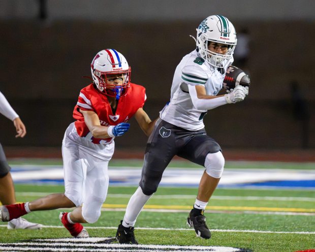 Pajaro Valley High's Andrew Chavez intercepts a pass intended for Independence's Trustin Nguyen during the teams' nonleague football game in San Jose on Friday. (Raul Ebio - Santa Cruz Sentinel)