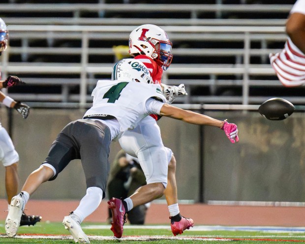 Pajaro Valley High's Lucas Ortiz knocks away a pass intended for Independence's Jessiah Amaral during the teams' nonleague football game in San Jose on Friday. (Raul Ebio - Santa Cruz Sentinel)