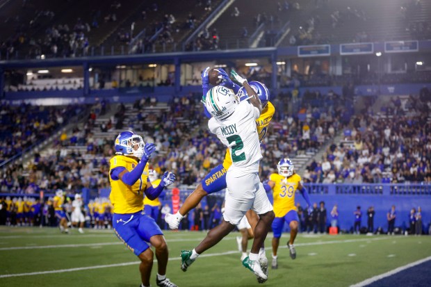San Jose State cornerback Caleb Womack intercepts a pass intended for Cal Poly-SLO receiver Tayvion McCoy during the fourth quarter at CEFCU Stadium in San Jose on Saturday. (Shae Hammond - Bay Area News Group)