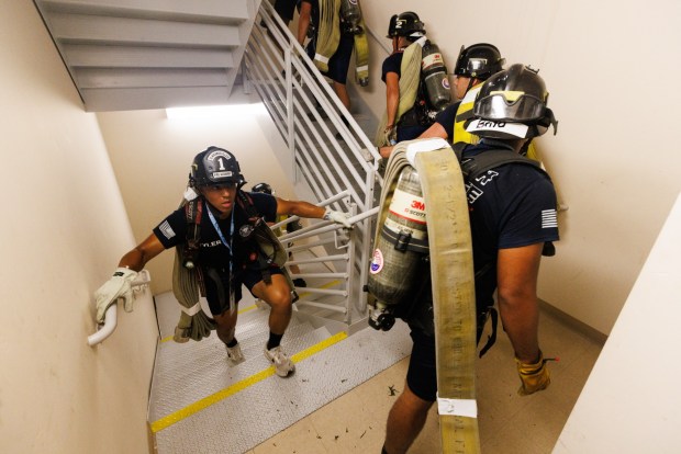 Damein Tyler, 25, a Miramar College Fire Academy cadet, climbs up the Hilton Bayfront Hotel during the San Diego 9/11 Memorial Stair Climb in downtown San Diego on Saturday, Sept. 5, 2026. Tyler, fellow fire academy cadets and other participants climbed up the staircase three times in honor of fallen 9/11 first responders. (Kristian Carreon / The San Diego Union-Tribune)