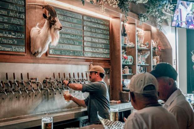 Bartender Regan Vaca pours beverages at Bock Bar on Thursday, August 20, 2026. (Photo by Sandy Huffaker for The San Diego Union-Tribune)