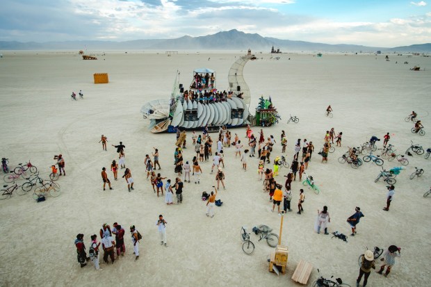 People gathered for a party at the Axolotl art car in the deep playa during the annual Burning Man celebration in the Black Rock Desert in Nevada on Wednesday, Aug 28, 2019. (Photo by Watchara Phomicinda, The Press-Enterprise/SCNG)
