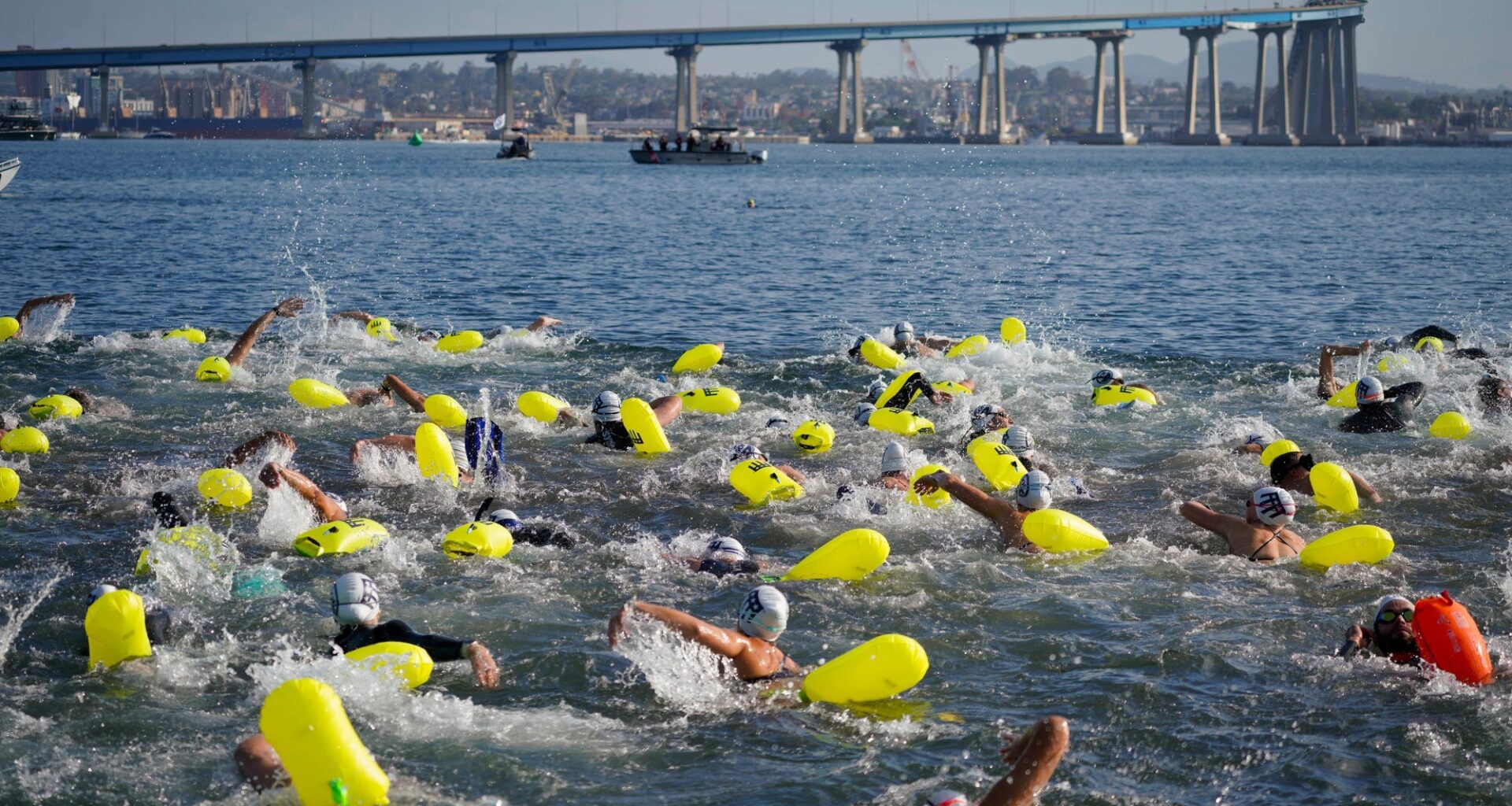 Meet the charity which has people swimming from Coronado to the USS Midway