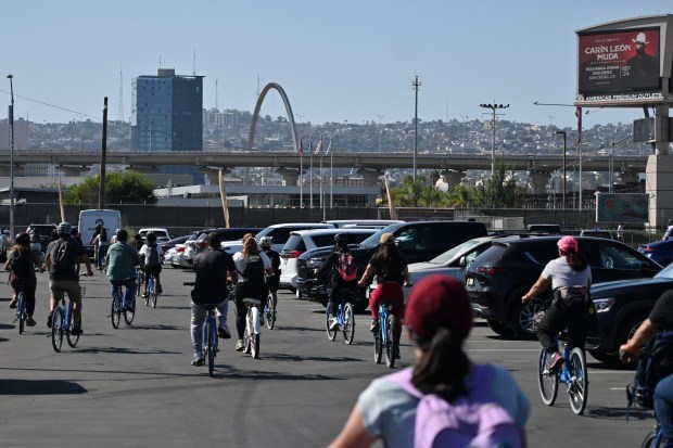 Bike advocates ride bikes that were reassembled and donated from the Nevada desert at the Burning Man festival truck bikes ready for volunteers from both sides of the border to cross through the San Ysidro Port of Entry to Tijuana, Mexico on Saturday, September 19, 2026. The bikes will be repurposed for people to use like migrants and mothers looking for their disappeared family members in Mexico. (Carlos Moreno / For The San Diego Union-Tribune)